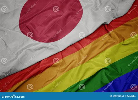 Waving Colorful Gay Rainbow Flag And National Flag Of Japan Stock Image