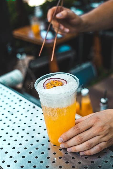 The Bartender Prepares A Cocktail With Passion Fruit Stock Image