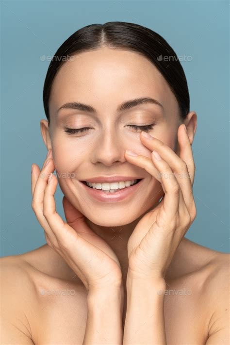 Woman With Natural Makeup Combed Hair Touching Her Well Groomed Pure