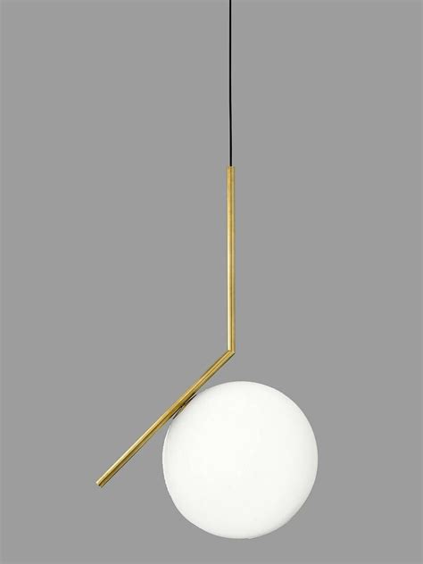 A White And Gold Light Hanging From A Ceiling Fixture With A Black Cord