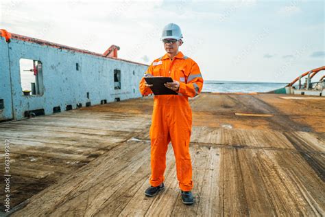 Filipino Deck Officer On Deck Of Offshore Vessel Or Ship Wearing Ppe Personal Protective