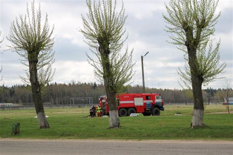 A Large Red Fire Rescue Vehicle A Truck To Extinguish A Fire And Male