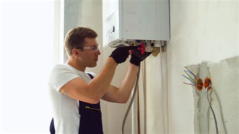 Professional Engineer Installing A Natural Gas Boiler At Home He Is