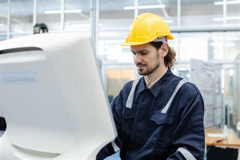 Man Engineer Using Computer Controlling Cnc Machine At Workshop