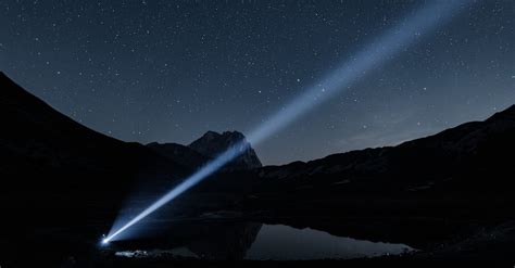 flashlight shining  night sky  stock photo
