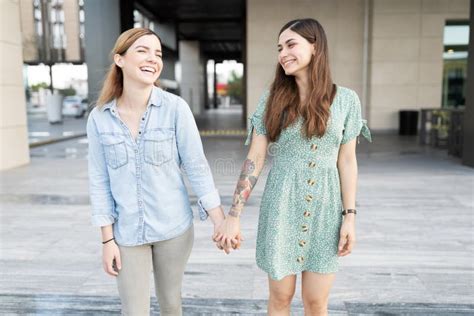 Gay Couple Smiling And Holding Hands Stock Photo Image Of Bisexual Date
