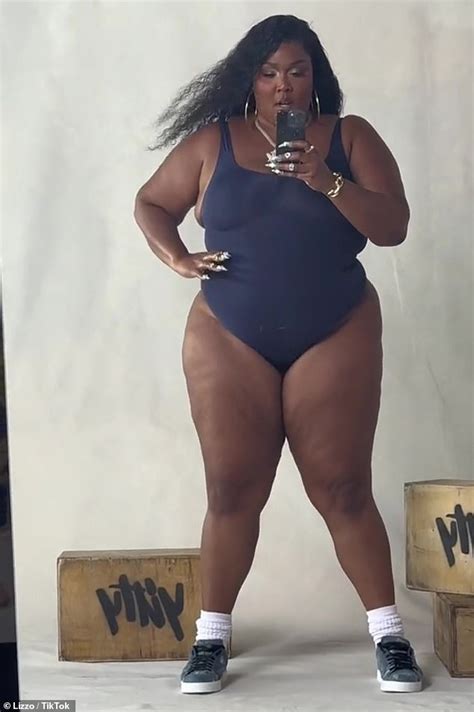 Lizzo Flaunts Her Incredible Curves In A Navy Blue High Cut Swimsuit As