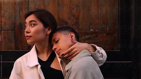 Cheerful Lesbian Couple Hugging On Street By Stocksy Contributor