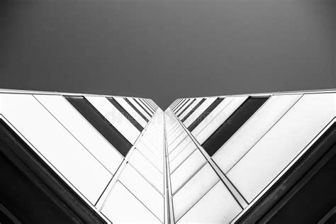 Low Angle Grayscale Shot Of A Building Under A Clear Sky Stock Image