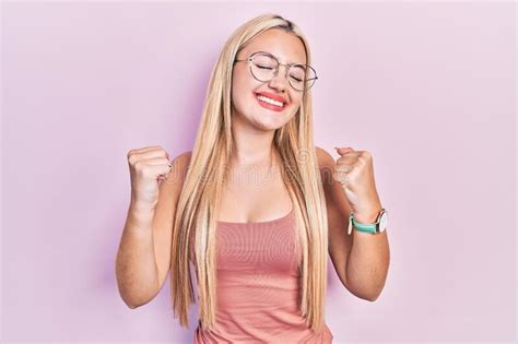 Young Blonde Girl Wearing Casual Clothes Very Happy And Excited Doing