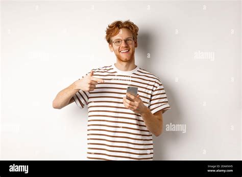 Technology And E Commerce Concept Young Man With Red Messy Hair