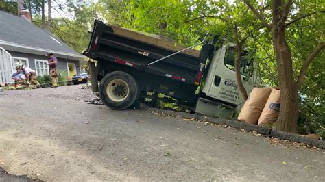 Unattended Dump Truck Rolls Off Road In Hartsdale