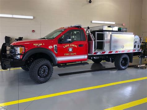 A Red Fire Truck Parked In A Garage