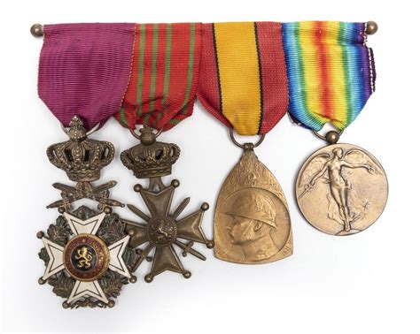 A Group Of Four Mounted Belgian Medals Comprising Order Of