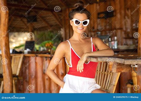 Young And Woman Sitting In Authentic Beach Bar With A Coconut Drink Stock Image Image Of