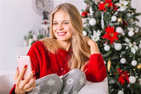 Free Photo Blond Woman In Sweater Taking Selfie