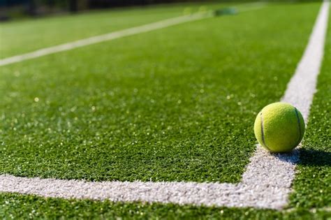 Premium Photo View Of Empty Lawn Tennis Court With Tennis Ball