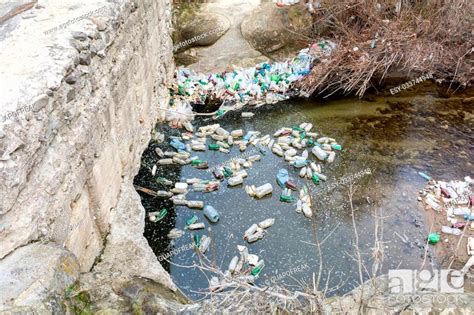 Rubbish Pollution With Plastic And Other Garbage In The River Stock