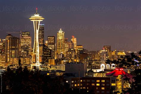 Seattle Skyline And Mount Rainier At Night By Stocksy Contributor