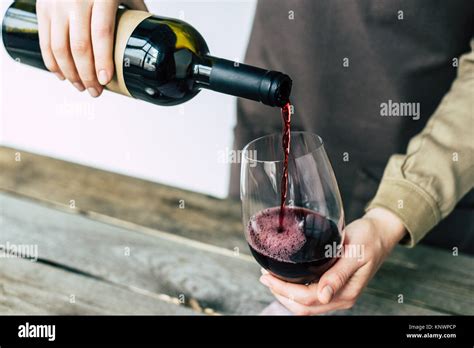 Sommelier Pouring Red Wine Into Glass Stock Photo Alamy