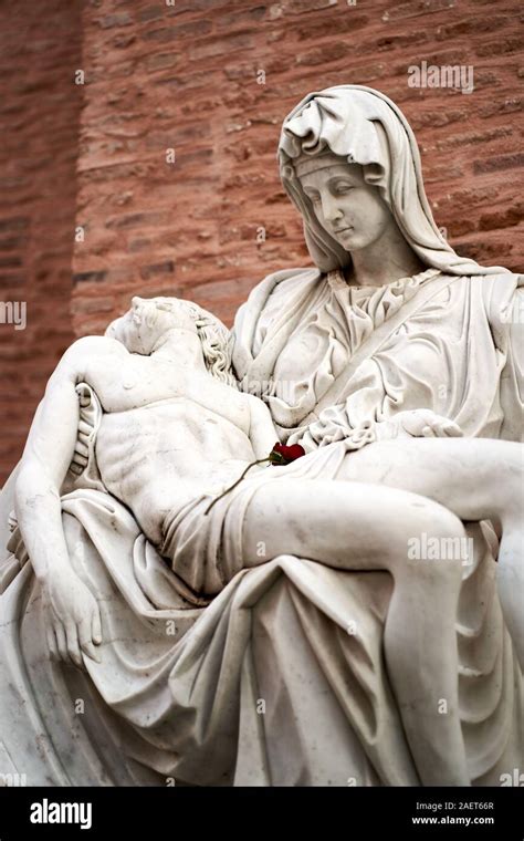 An Elaborate Memorial In Marble Featuring A Shrouded Woman Holding A