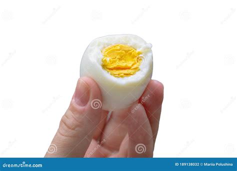 Boiled Bitten Egg In Human Fingers Isolated On White Stock Photo