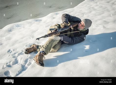 Instructor Demonstrate Body Position Of Combat Rifle Shooting At Winter