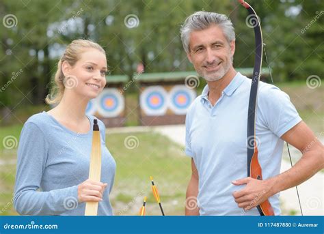 Couple Holding Bows and Arrows Stock Photo - Image of arrow, training ...