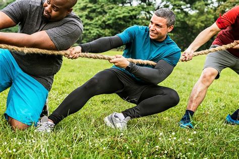 Team competing in tug of war | Premium Photo - rawpixel