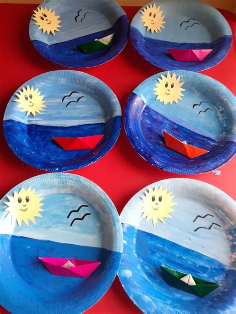 Four Paper Plates With Boats On Them Painted To Look Like They Are