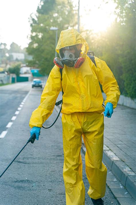 Coronavirus A Sanitation Worker Wearing A Mask And Cleaning The