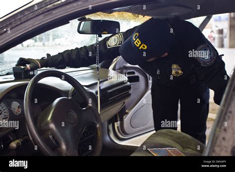 A Us Customs And Border Protection Officer Uses A Contraband Detection