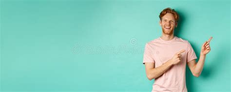 Handsome Male Model With Red Messy Hair Showing Advertisement On Copy