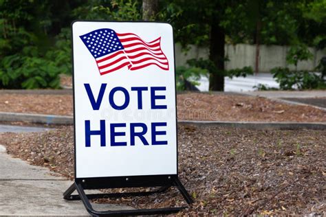 Polling Place Sign Encouraging Citizens To Vote Here At The Local