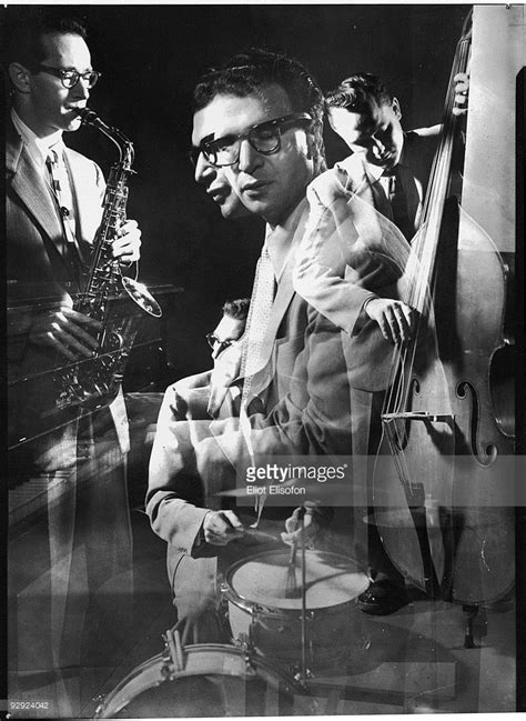 A Black And White Photo Of Three Men Playing Instruments