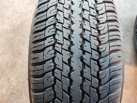 Dunlop 26560r18 110h Grandtrek At25 ランドクルーザープラド ホワイトレター 溝あり 4本セット中古品