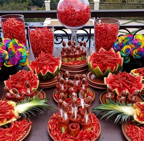 Takis And Tamarindo Fruit Table Mexican Snacks Mexican Dessert Table