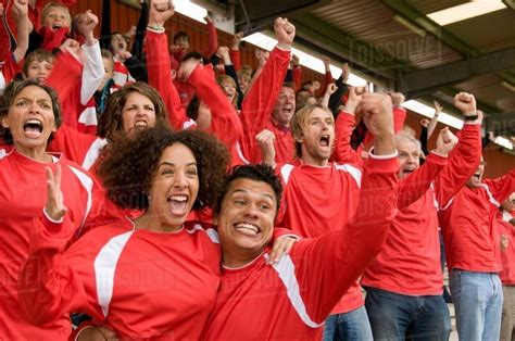 Fans Celebrating At At Football Match Stock Photo Dissolve