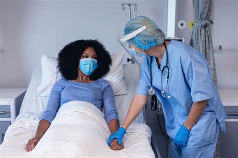 Premium Photo | Caucasian female doctor in hospital in face mask ...