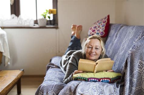 Beautiful Mature Woman Reading Book Feeling Cozy And Happy Weekend