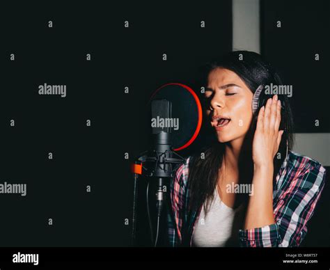 Beautiful Brunette Woman Recording Voice Song Or Album In Professional Studio Stock Photo Alamy