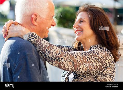 Older Caucasian Couple Hugging Outdoors Stock Photo Alamy