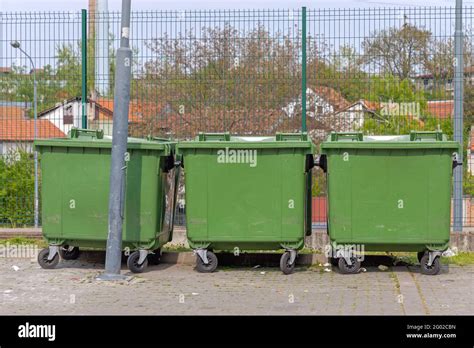 Three Green Plastic Dumpster Containers For Waste Stock Photo Alamy