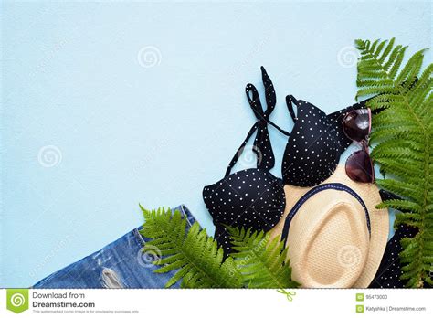 Female Summer Bikini Swimsuit And Accessories Collage On Blue With Palm