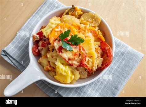 Casserole With Potato Sweet Potato Tomato And Cheese Stock Photo Alamy