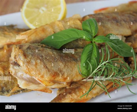 Fried Fish With Vegetables On White Plate Stock Photo Alamy