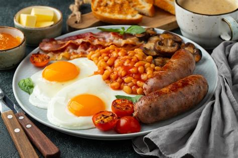 Premium Photo Full English Breakfast On A Plate With Fried Eggs