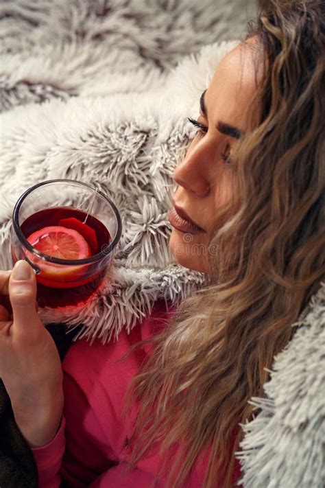 Young Sick Female In Bed Drinking Herbal Tea Vitamins And Hot Stock