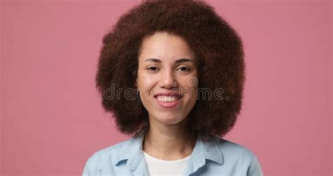 Smiling Attractive African American Woman Looking At The Mirror