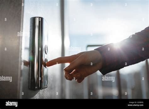 The Thumb Presses The Elevator Button A Hand Reaching For The Button The Girl Waiting For